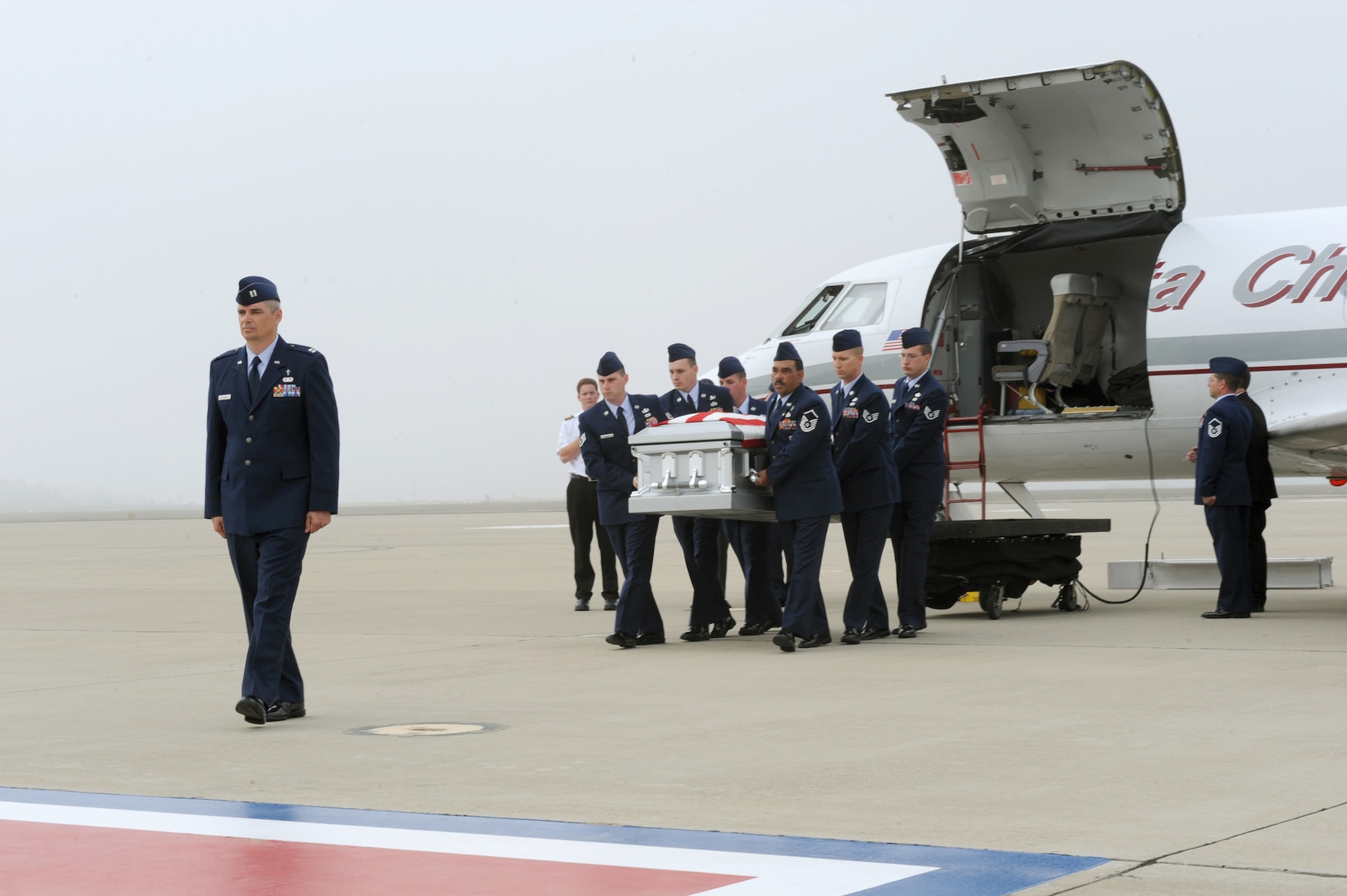 Members of the of 30th Civil Engineer Squadron explosive ordnance disposal flight here carry Senior Airman Daniel Johnson to a hearse Oct. 13, 2010, at Vandenberg Air Force Base, Calif. Airman Johnson, an EOD technician, was killed in the line of duty Oct. 5, 2010, in Kandahar, Afghanistan. (U.S. Air Force photo/Senior Airman Stephanie Longoria)