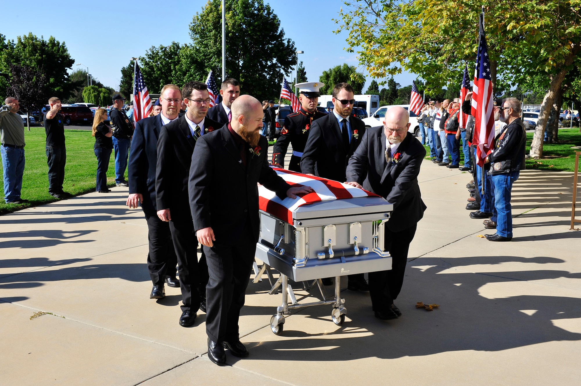 Family and friends of Senior Airman Daniel Johnson escort his remains into the First Christian Church Oct. 13, 2010, in Santa Maria, Calif. Airman Johnson, a 30th Civil Engineer Squadron explosive ordnance disposal flight technician, was killed in the line of duty Oct. 5, 2010, in Kandahar, Afghanistan. (U.S. Air Force photo/Tech. Sgt. Luke Thelen)