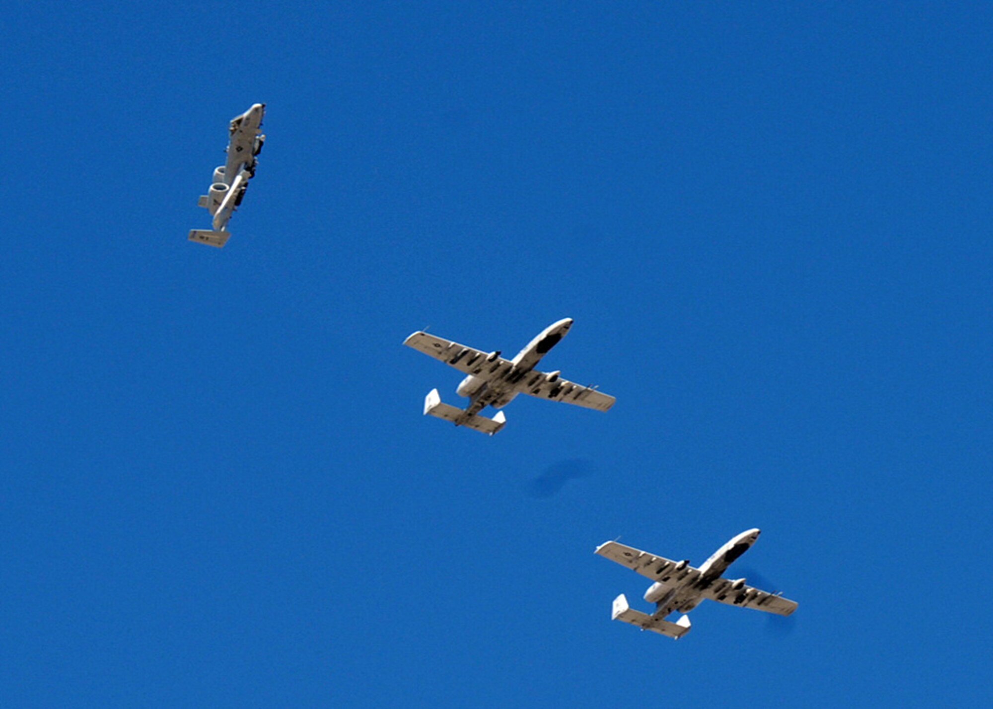 The first of three A-10 Thunderbolt IIs breaks formation before landing at Gowen Field in Boise, Idaho, for the 2010 Hawgsmoke competition. The competiton runs from Oct. 13 to 16.  (U.S. Air Force photo/Tech. Sgt. John Orrell)
