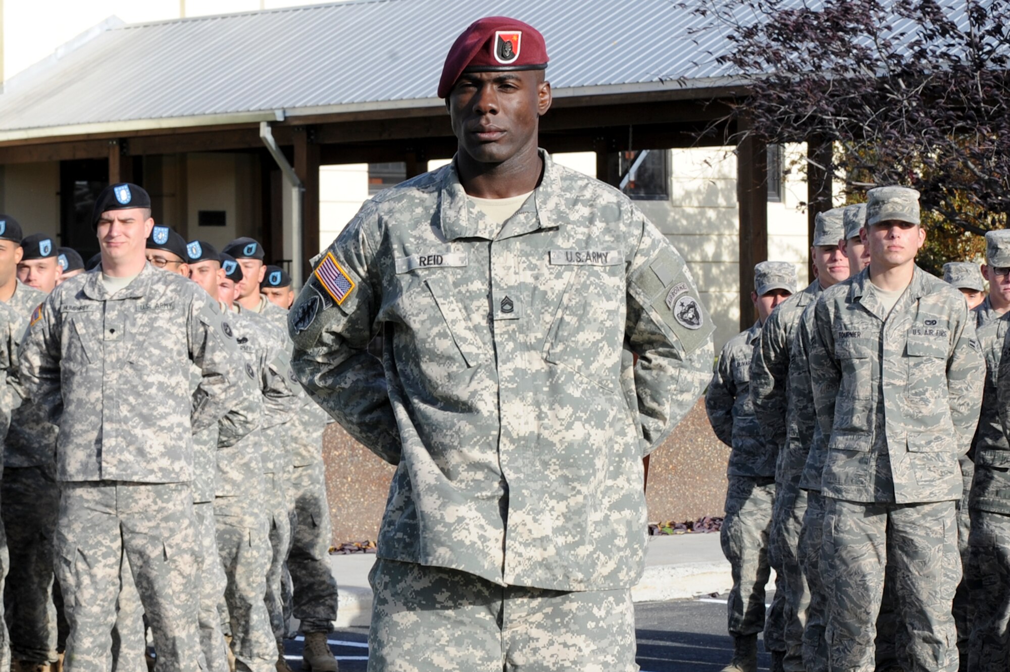 Sgt. 1st Class Yusef Reid, 56th Engineer Company, 6th Engineer Battalion, stands before a formation of Soldiers and Airmen at the annual POW/MIA Ceremony, Sept. 24. (U.S. Air Force phot/Staff Sgt. Joshua Garcia)
