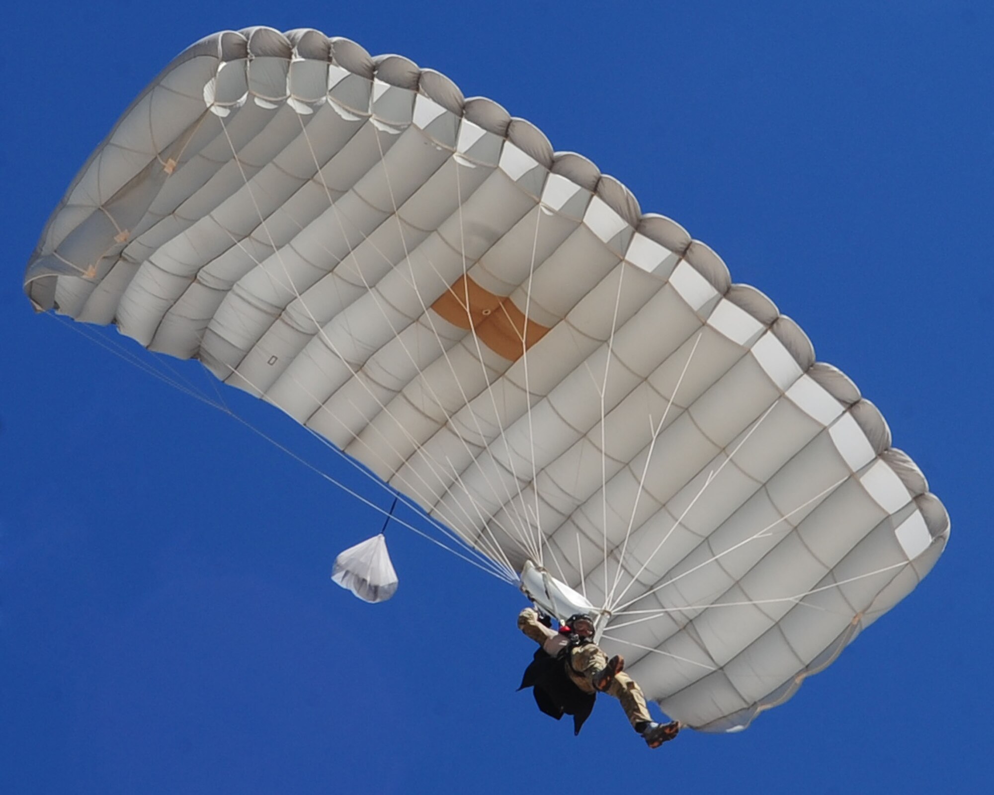 DAVIS-MONTHAN AIR FORCE BASE, Ariz. - A Pararescueman participating in the bi-annual PJ Rodeo competition descends to the ground during a free-fall parachute exercise here Oct. 9, 2010.  (U.S. Air Force photo/Airman 1st Class Jerilyn Quintanilla)
