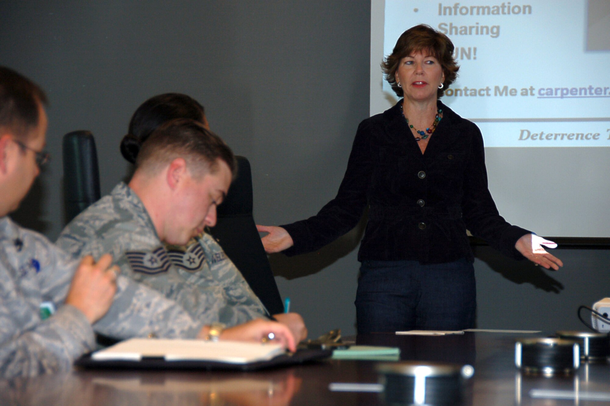 BOSSIER CITY, La. – Melissa Carpenter, wife of Maj. Gen. Floyd Carpenter, Eighth Air Force commander, talks to more than 15 new members of Eighth Air Force about the Eighth Air Force Spouses Club during a Right Start briefing at the Cyber Innovation Center in Bossier City, La., Oct. 15. This is the first Right Start briefing held at the CIC since Eighth Air Force moved off of Barksdale Air Force Base in April. The move was the result of a need to relocate and renovate facilities at Barksdale with the arrival of Air Force Global Strike Command. The Right Start brief offers Eighth Air Force newcomers an entry-level understanding of the Eighth Air Force organization, as well as a brief discussion of the “Mighty Eighth” history and legacy. (U.S. Air Force photo by Staff Sgt. Brian Stives)