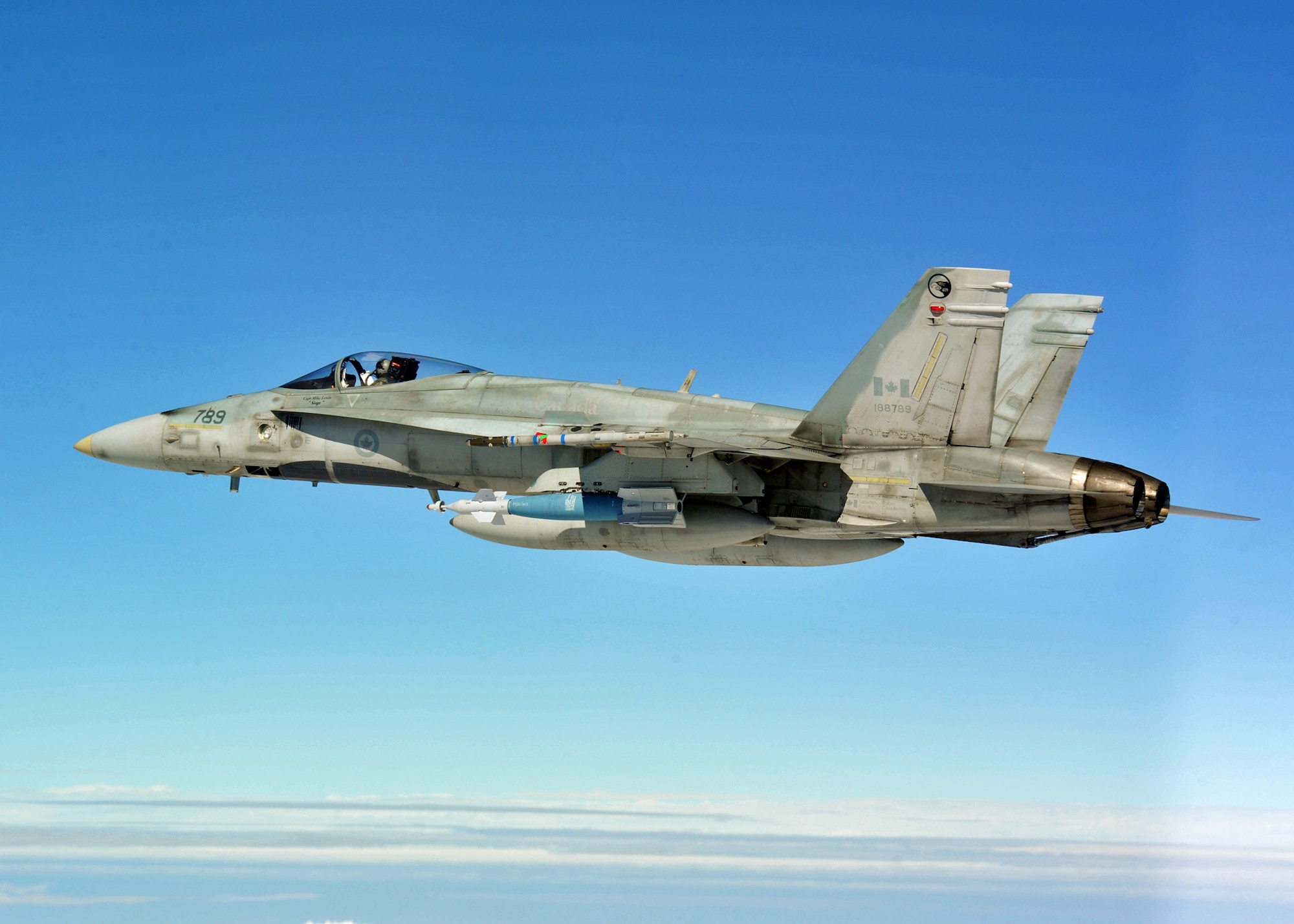 A Canadian Air Force CF-18 flies over the Eglin Air Force Base range during an air-to-ground Weapons System Evaluation mission.  The 86th Fighter Weapons Squadron conducts the WSEP program at Eglin.  The WSEP program is used to evaluate the effectiveness and suitability of combat air force weapon systems. The evaluations are accomplished during tactical deliveries of fighter, bomber and unmanned aerial system precision guided munitions, on realistic targets with air-to-air and surface-to-air defenses. For many of the aircrew participating in WSEP, it is the first time employing live weapons. This provides a level of combat experience many units face during combat. Courtesy photo.