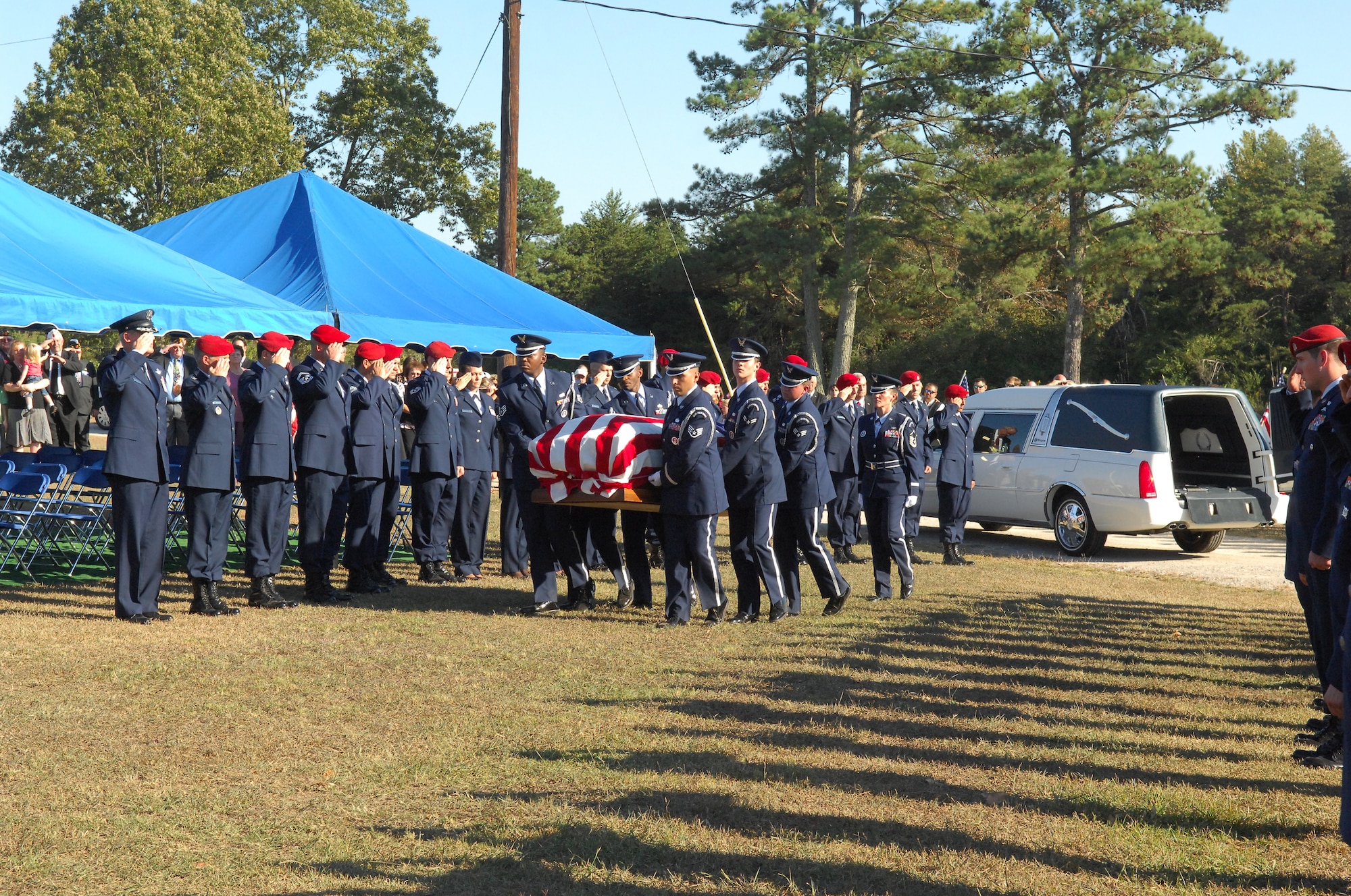Airmen salute Senior Airman Mark A. Forester as he is laid to rest in Haleyville, Ala.  Airman Forester was killed Sept. 29 during combat operations in Uruzgan Province, Afghanistan. (U.S. Air Force photo by Senior Airman Kristopher T. Levasseur/43rd Airlift Wing Public Affairs)
