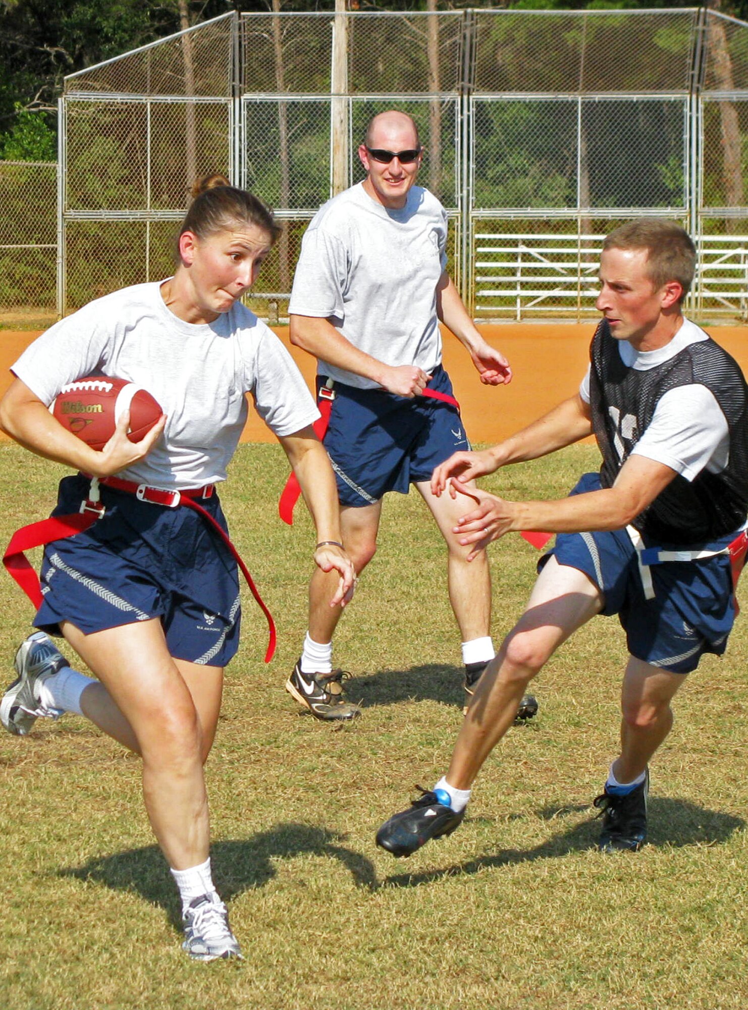 Tech. Sgt. Melody Autry, 46th Maintenance Group, moves the ball downfield during the 46th Test Wing and 96th Air Base Wing flag football game, Oct. 14 at Eglin Air Force Base, Fla.  The 46 team defeated the 96, 21-14.  (U.S. Air Force photo/Irene Freiberg)
