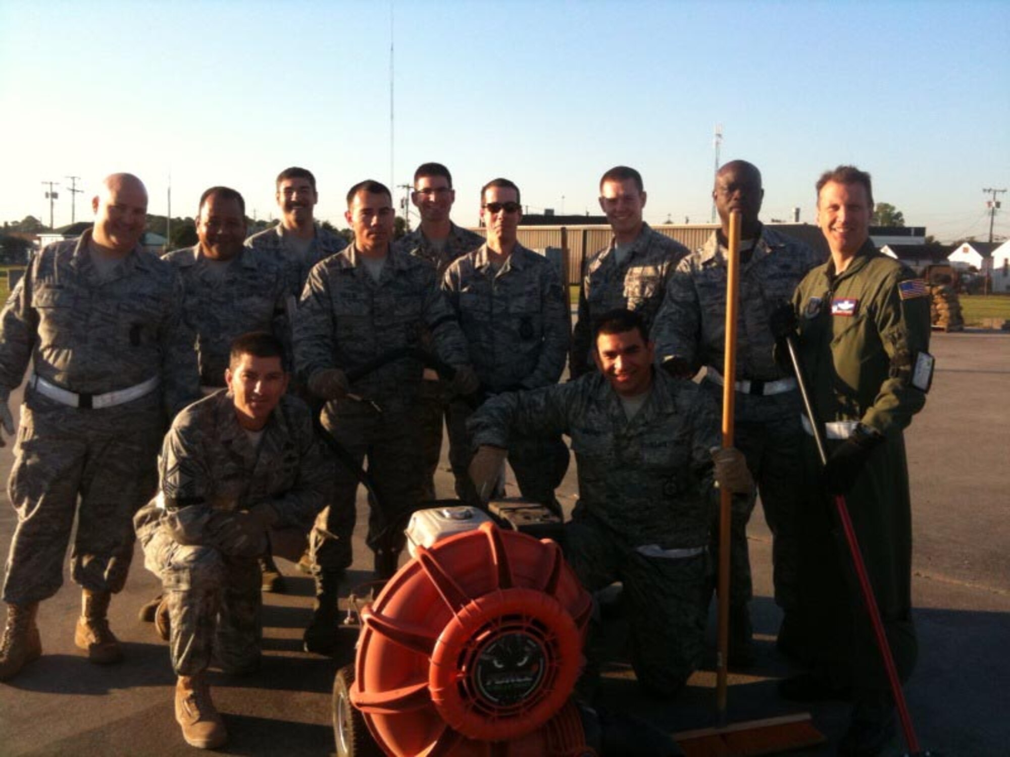 Airmen of the 916th Air Refueling Wing, to include Wing Commander Col. Randy Ogden (far right), know at the end of the day it's all about teamwork. This crew stayed behind to help clean up sandbags used during the wing's exercise in Savannah. (USAF photo by Col. James Hurley, 916MSG/CC)
