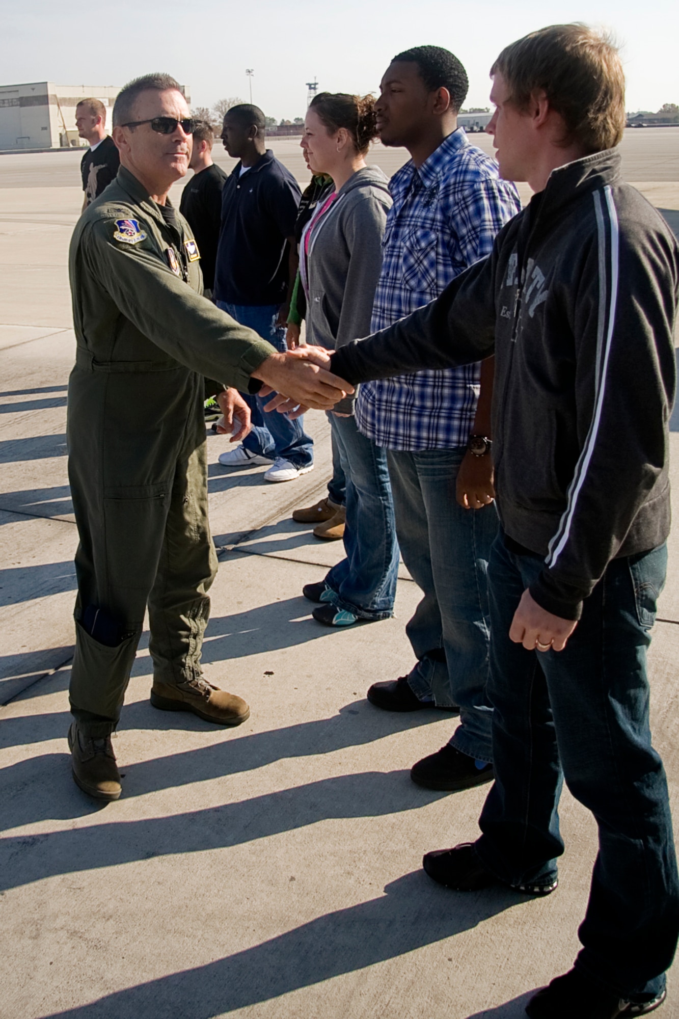 GRISSOM AIR RESERVE BASE, Ind. -- Col. William T. "Tim" Cahoon, 434th Air Refueling Wing commander, shakes the hand of Craig Garrison after administering the oath of enlistment to several Air Force Reserve recruits in front of a 434th ARW KC-135R Stratotanker Oct. 12. (U.S. Air Force photo/Tech. Sgt. Mark R. W. Orders-Woempner)