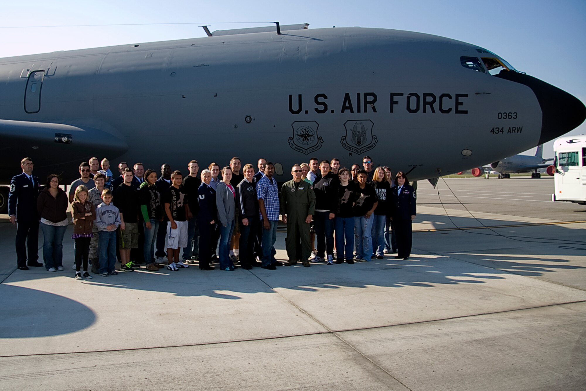 GRISSOM AIR RESERVE BASE, Ind. -- Newly sworn in Air Force Reserve recruits, their families and recruiters pose for a photo with Col. William T. "Tim" Cahoon in front of a KC-135R Stratotanker at Grissom Oct. 12. Shortly after the photo was taken, the recruits boarded the aircraft to witness an aerial refueling mission. Colonel Cahoon is the 434th ARW commander. (U.S. Air Force photo/Tech. Sgt. Mark R. W. Orders-Woempner)