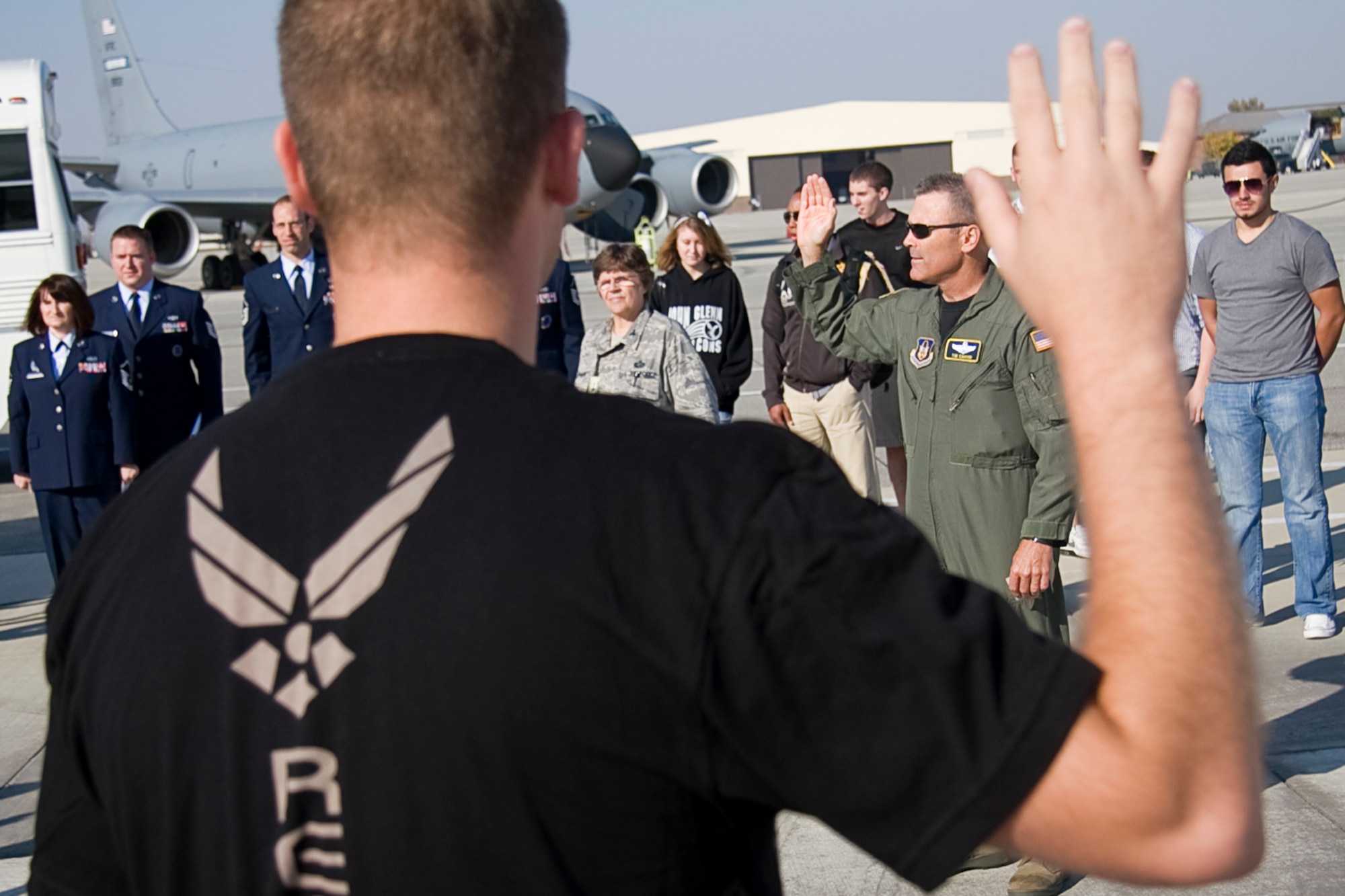 GRISSOM AIR RESERVE BASE, Ind. -- Col. William T. "Tim" Cahoon, 434th Air Refueling Wing commander, administers the oath of enlistment to a group of Air Force Reserve recruits as their families, friends and recruiters watch on Oct. 12. (U.S. Air Force photo/Tech. Sgt. Mark R. W. Orders-Woempner)