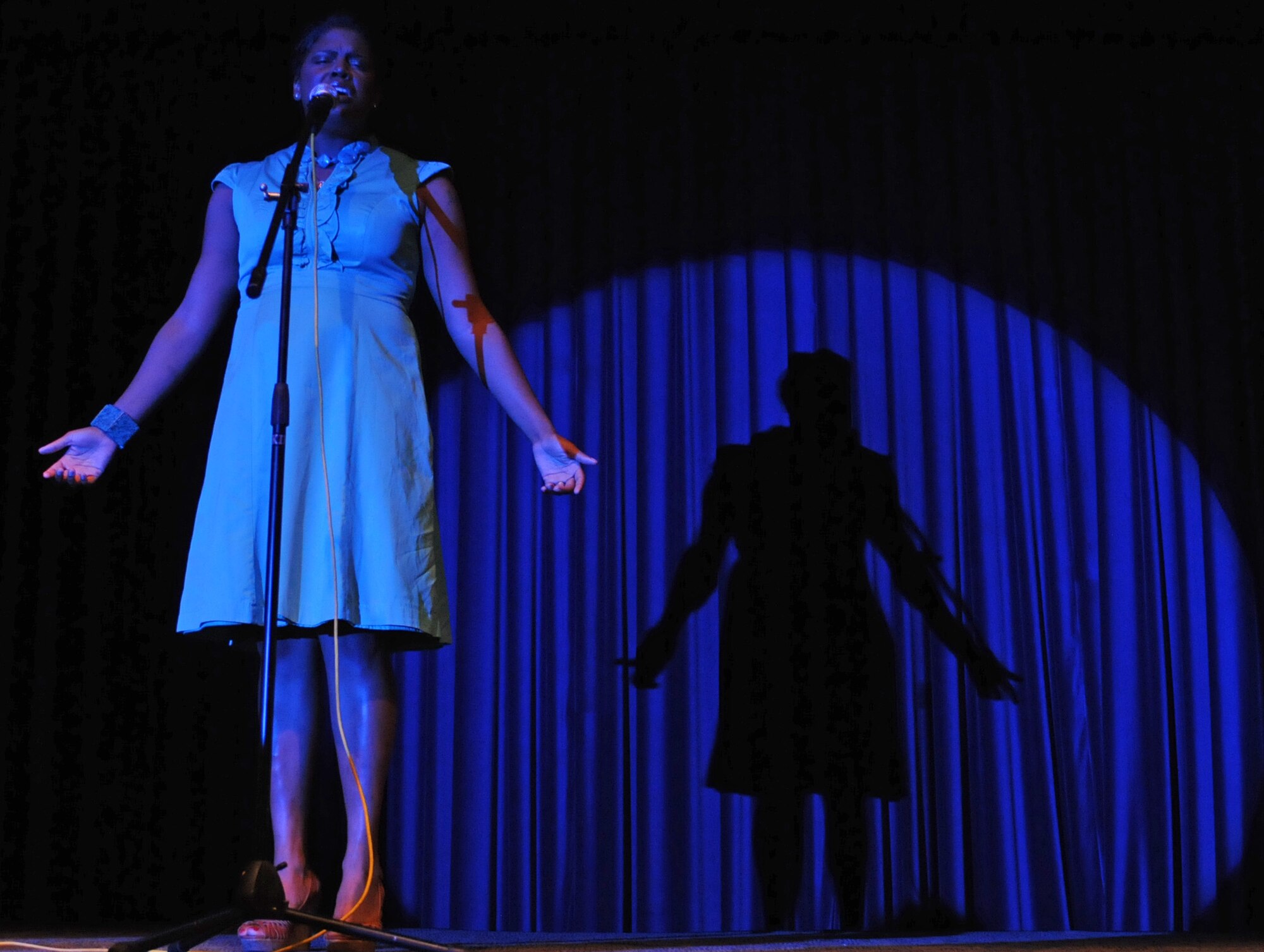 Senior Airman April Bailey, 39th Logistics Readiness Squadron, performs her first song of the night during the last night of Incirlik Idol at the Club Complex Oct. 7, 2010. Eight Incirlik members competed in the event for an audience of nearly 200. (U.S. Air Force photo/Senior Airman Sara Csurilla)
