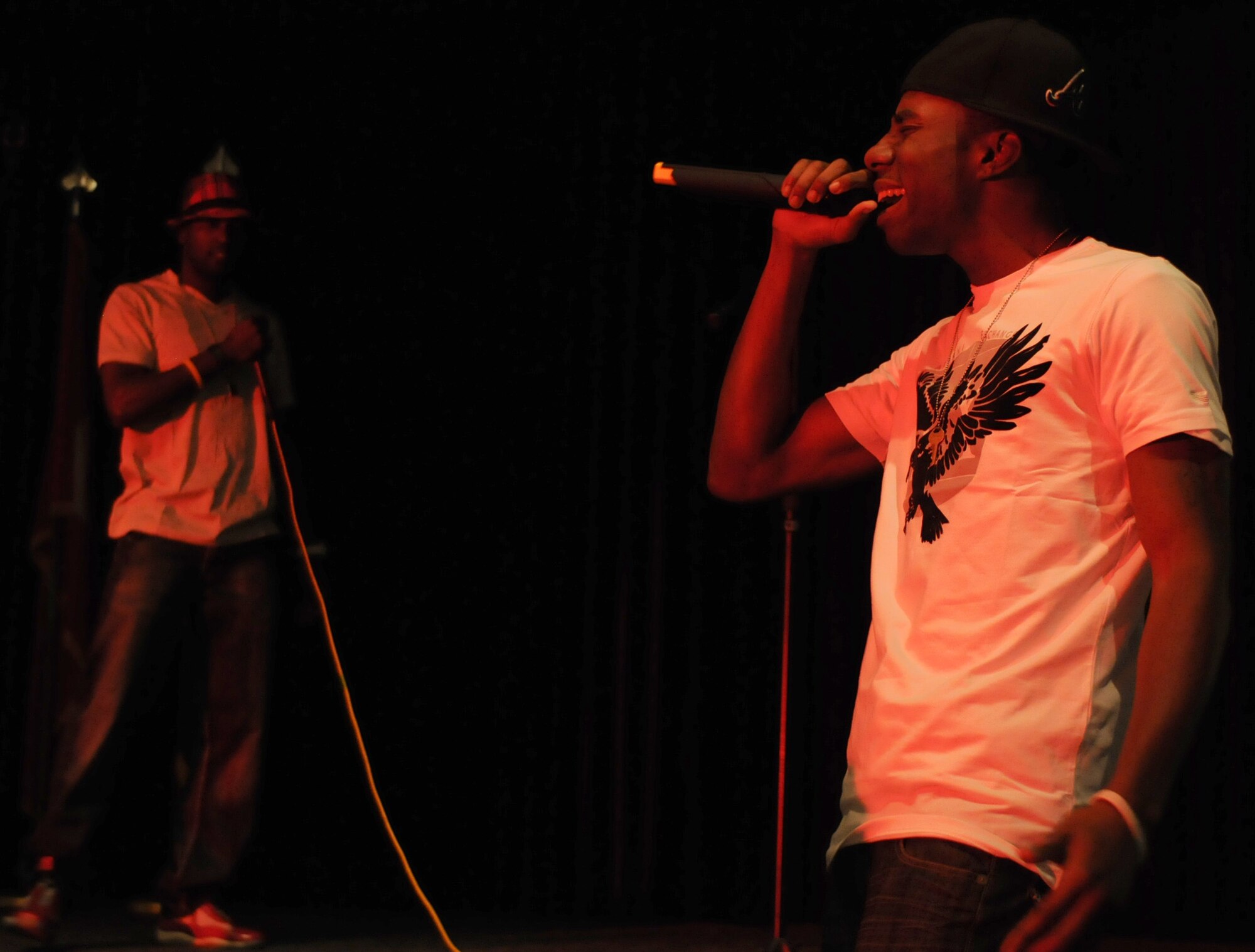 Airman 1st Class Joshua Davis aka J-Wayne and Airman 1st Class Andrew Lomax aka Lo-Max, a group named 1-Sound and both part of the 39th Logistics Readiness Squadron perform one of their own songs during the last night of Incirlik Idol at the Club Complex Oct. 7, 2010. The group 1-Sound won the competition in front of nearly 200 Incirlik members. (U.S. Air Force photo/Senior Airman Sara Csurilla)