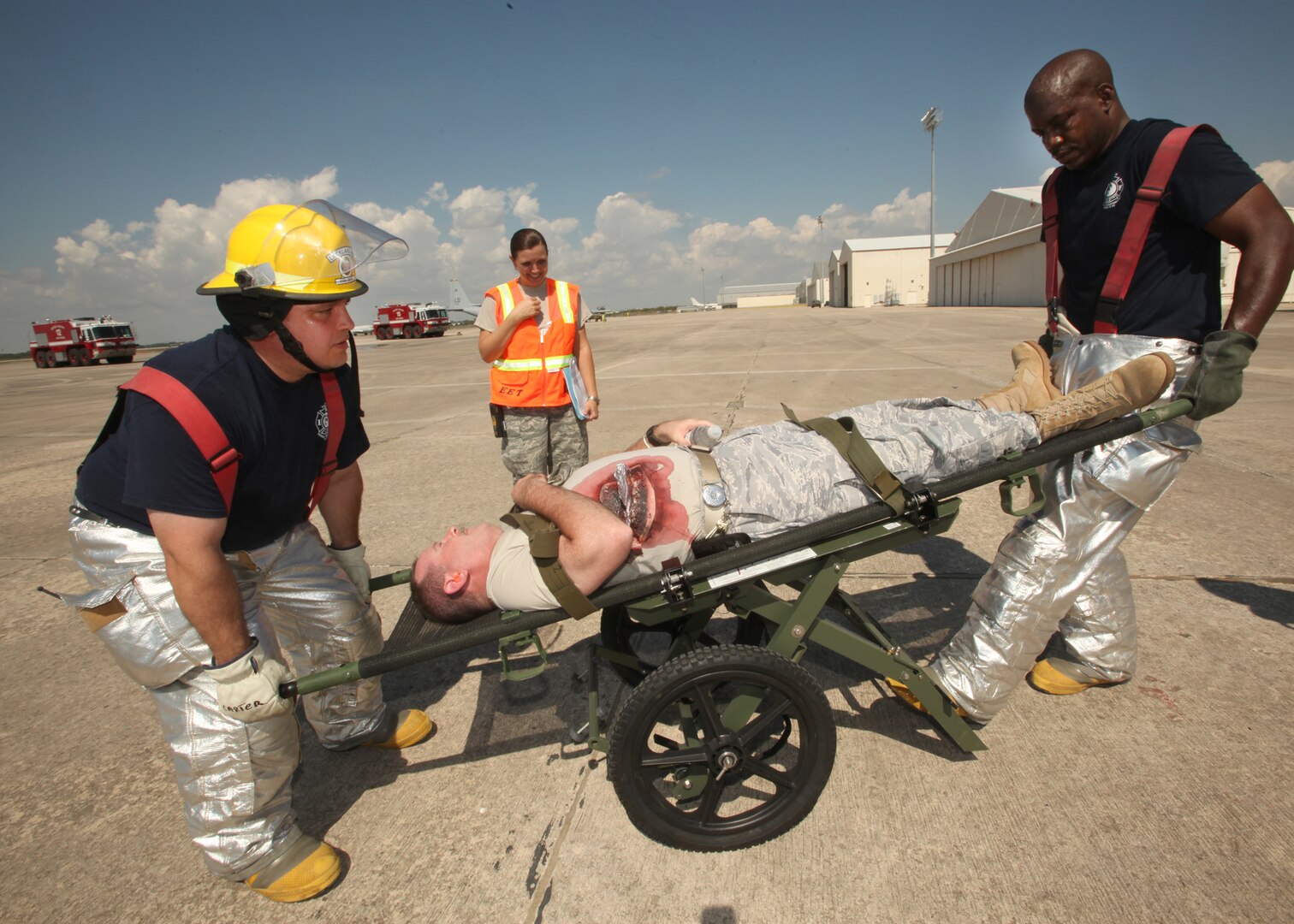 Members of the 802nd Civil Engineer Squadron transport a simulated patient during the major accident response exercise Oct. 12. (U.S. Air Force photo/Robbin Cresswell)
