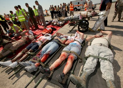 Emergency responders prepare simulated victims for transport during the major accident response exercise Oct. 12. The exercise involved units from the 502nd Air Base Wing and the 59th Medical Wing, as well as the San Antonio Fire Department. (U.S. Air Force photo/Robbin Cresswell)