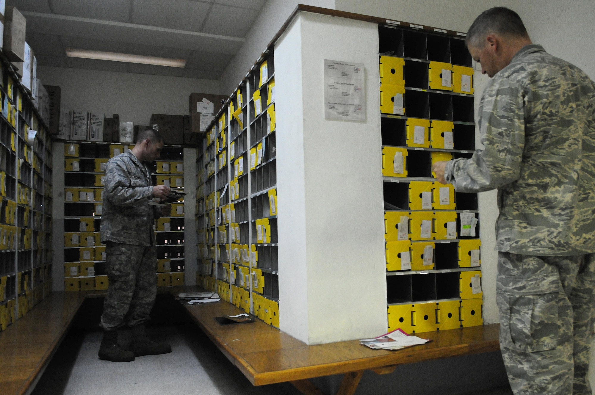 Col. Anthony Butts, 39th Air Base Wing vice commander, and Maj. Joseph Schaefer, 39th Comptroller Squadron commander, separate mail Oct. 13, 2010 at Incirlik Air Base, Turkey.  The ODC processes approximately 900 packages each week and is often supported by volunteer assistance.  (U.S. Air Force photo by Senior Airman Ashley Wood/Released)