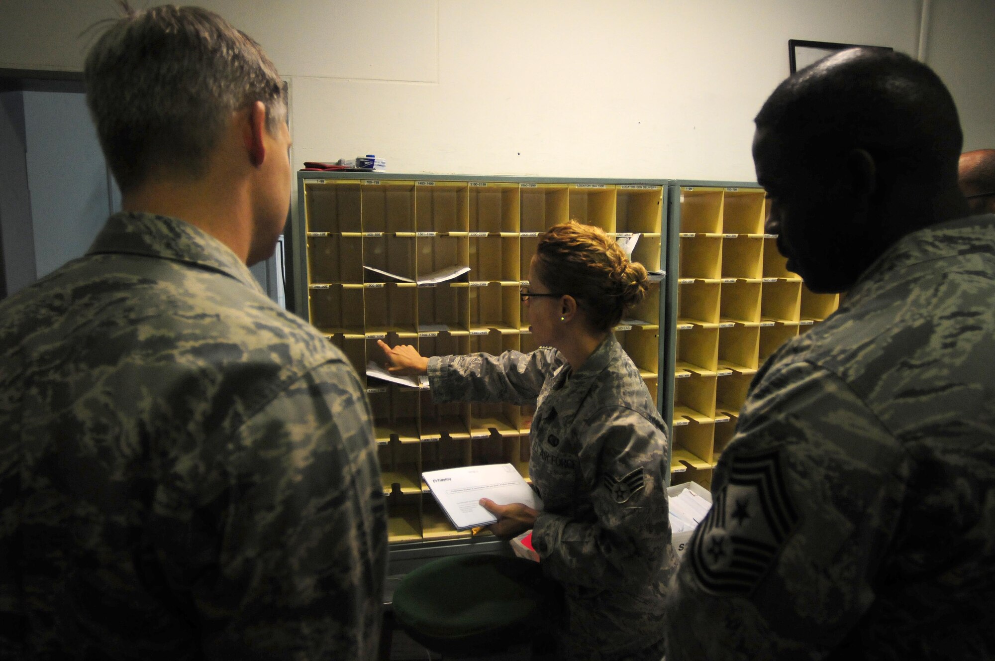 Senior Airman Nellie Bourdier, 39th Communications Squadron postal clerk, explains postal procedures to wing leadership Oct. 13, 2010 at Incirlik Air Base, Turkey.  The ODC processes approximately 900 packages each week and is often supported by volunteer assistance.  (U.S. Air Force photo by Senior Airman Ashley Wood/Released)