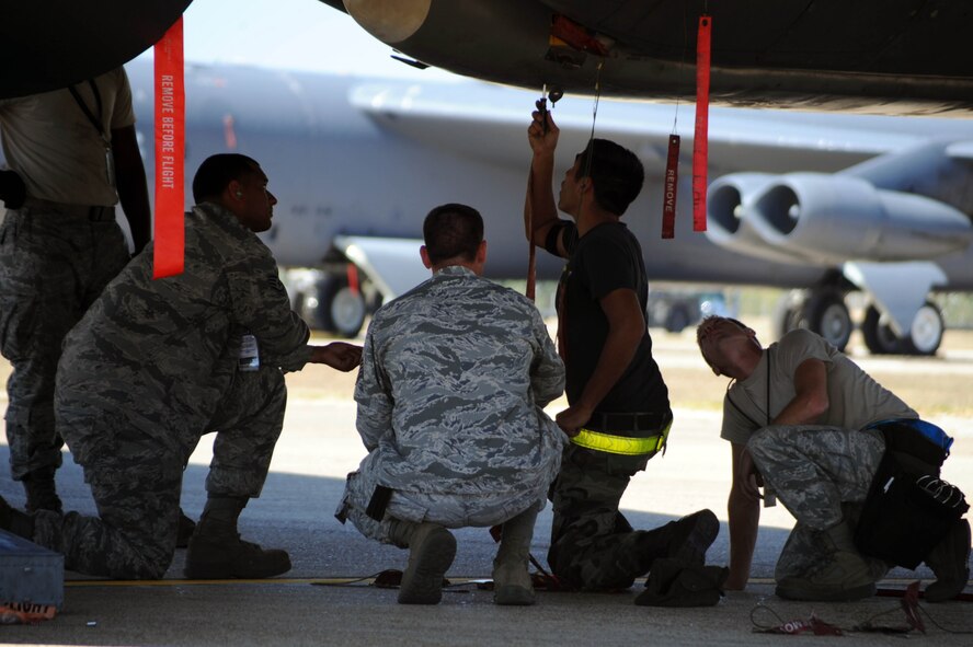 BARKSDALE AIR FORCE BASE, La. -- Airmen from the 2nd Munitions Squadron weapons load crew perform safe maintenance checks to prepare for a no-notice Nuclear Surety Inspection, Oct. 7. An NSI is designed to evaluate a unit's ability to execute nuclear operations in a safe, secure and reliable manner. (U.S. Air Force photo/Senior Airman Brittany Y. Bateman)(RELEASED)