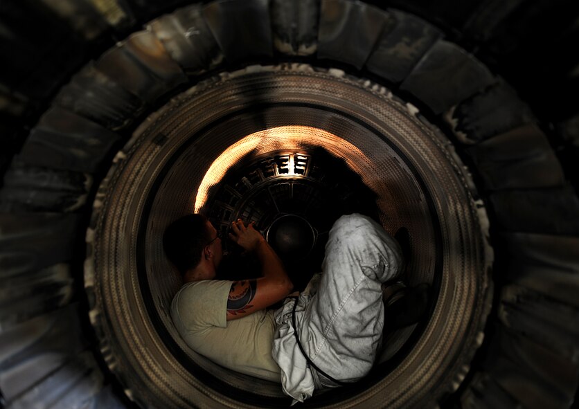 Senior Airman John Fleetwood inspects an augmenter flame-holder and spray-rings during an engine tear down, Oct. 14. Airman Fleetwood and his wingmen of the 18th Component Maintenance Squadron Propulsion Flight at Kadena Air Base, Japan, keep Kadena's F-15's in the air. More than 200 engines are maintained by this unit, providing support for F-15's as well as A-10's from Osan Air Base, Korea. (US Air Force photo/Staff Sgt. Christopher Hummel)