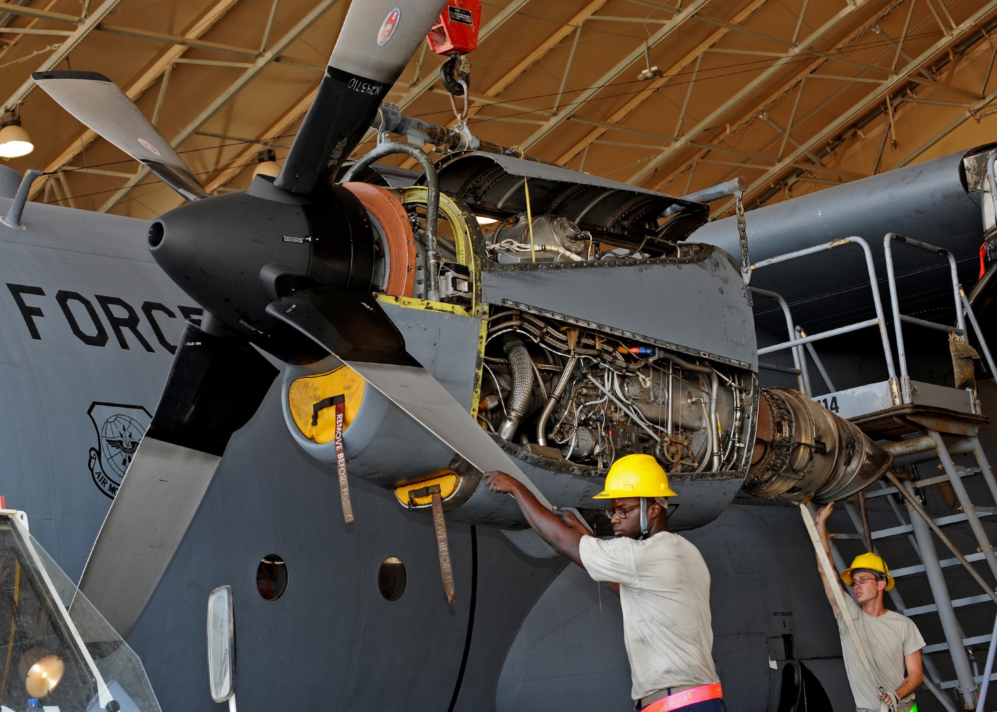 SOUTHWEST ASIA - Members of the 386th Expeditionary Maintenance Group work on the turboprop of a C-130 Hercules aircraft at an undisclosed air base here Aug. 20, 2010. The maintenance group's proactive approach to operations has helped it attain a mission effectiveness rate in excess of 99 percent, officials said. (U.S. Air Force photo by Senior Airman Laura Turner/Released)