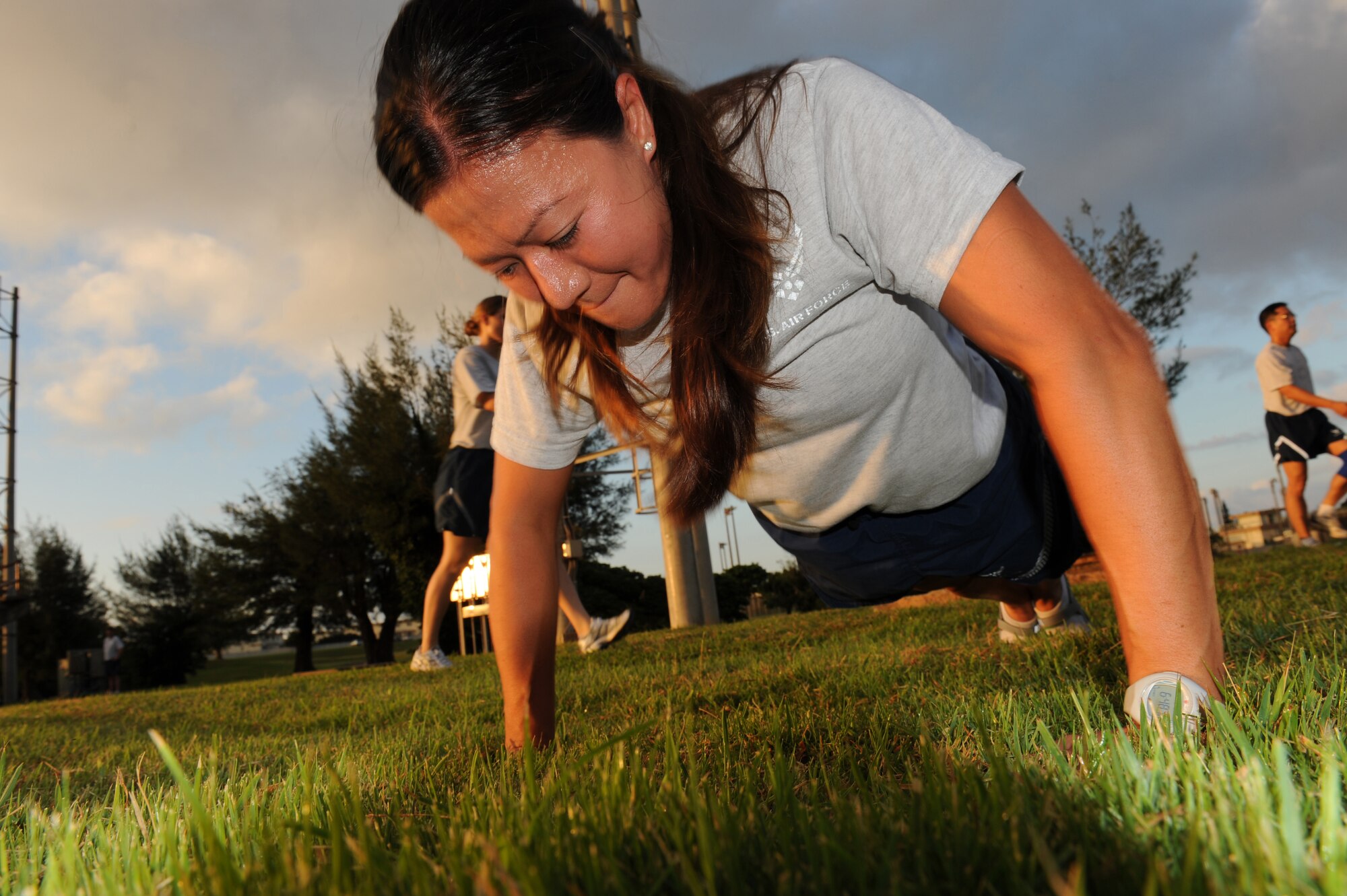 Master Sgt. Tenny Sharp performs pushups during a squadron PT session, Sep. 28. The 390th Intelligence Squadron combines elements inspired by P90X and Crossfit with traditional exercise techniques for a well-rounded PT program, resulting in better total-body fitness. (U.S. Air Force Photo/Tech. Sgt. Jason W. Edwards)