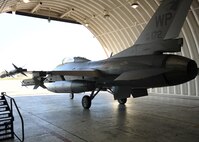 KUNSAN AIR BASE, Republic of Korea -- An F-16 Fighting Falcon from the 80th Fighter Squadron takes off from its hangar for exercise Max Thunder here Oct. 15, 2010.  The exercise is a training opportunity that aims to test aircrews’ war-fighting skills in realistic combat situations that combine both Republic of Korea Air Force and U.S. Air Force flying and maintenance personnel. (U.S. Air Force photo/Senior Airman Ciara Wymbs)   