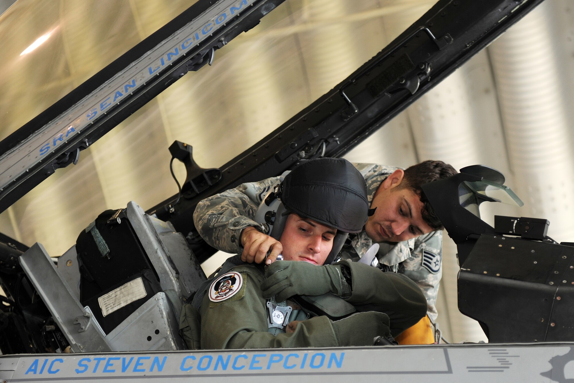 KUNSAN AIR BASE, Republic of Korea --    Staff Sgt. Shane Balow, 8th Aircraft Maintenance Squadron crew chief, assists Capt. Bryan Dalton, 80th Fighter Squadron F-16 pilot, with properly strapping into the cockpit prior to Capt. Dalton taking off to participate in Max Thunder at Kwangju Air Base.  Max Thunder exercise is a 7th Air Force-designed, bi-lateral training opportunity that aims to test aircrews' war-fighting skills in realistic combat situations that combine both Republic of Korea Air Force and U.S. Air Force flying and maintenance personnel.  (U.S. Air Force photo/Staff Sgt. Jonathan Pomeroy)