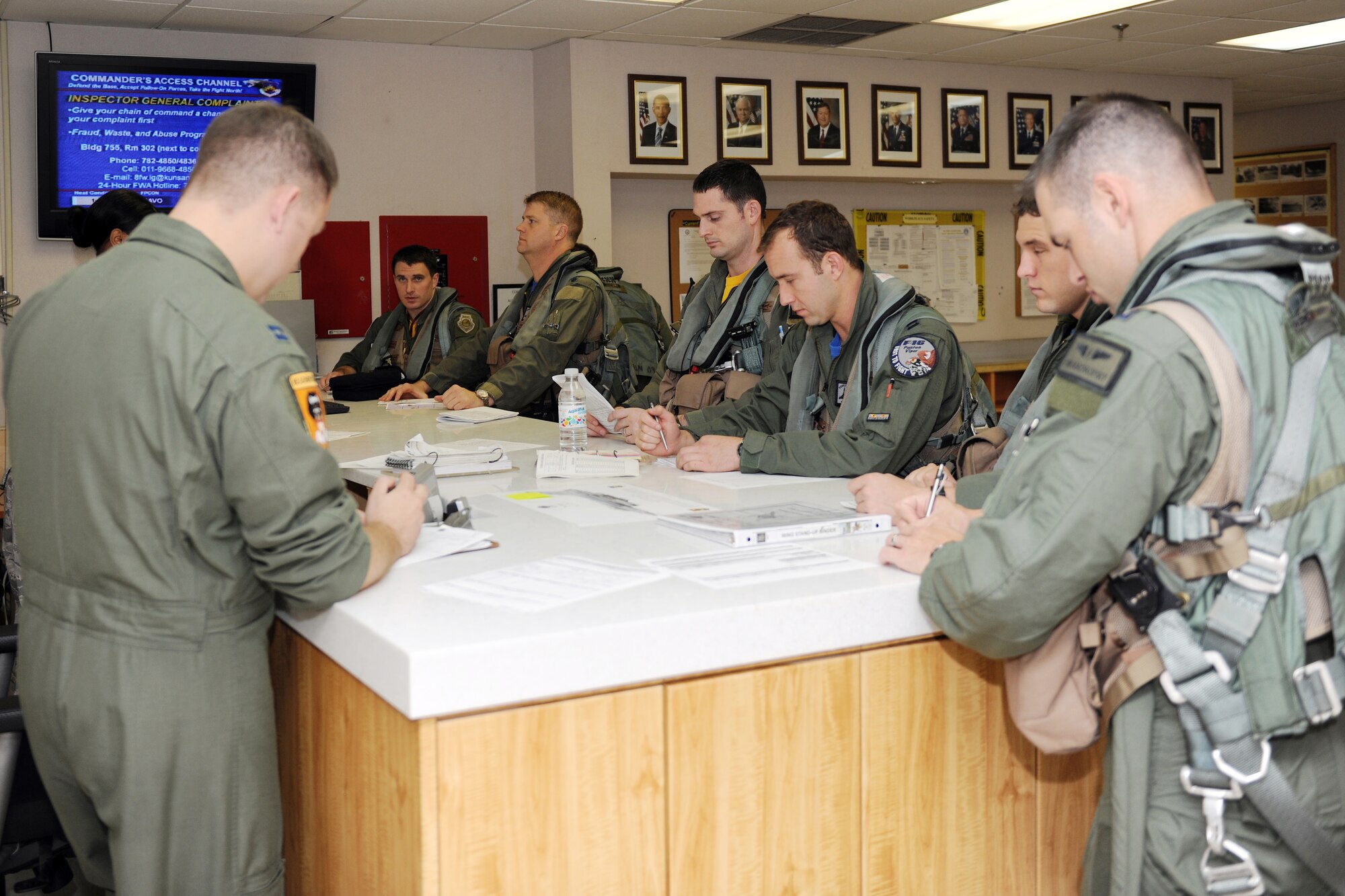 KUNSAN AIR BASE, Republic of Korea --   80th Fighter Squadron F-16 Fighting Falcon pilots, review their mission orders prior to taking off to participate in Max Thunder at Kwangju Air Base.  Max Thunder exercise is a 7th Air Force-designed, bi-lateral training opportunity that aims to test aircrews' war-fighting skills in realistic combat situations that combine both Republic of Korea Air Force and U.S. Air Force flying and maintenance personnel.  (U.S. Air Force photo/Staff Sgt. Jonathan Pomeroy)