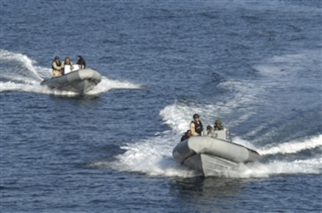 U.S. Navy sailors with the visit, board, search and seizure team aboard the guided-missile destroyer USS Stout (DDG 55) speed through the northeastern Atlantic Ocean in rigid hulled inflatable boats while conducting maritime interdiction operations for Joint Warrior 10-2 on Oct. 11, 2010.  Joint Warrior is a multinational exercise designed to improve interoperability between allied navies and prepare participating crews to conduct combined operations during deployment.  