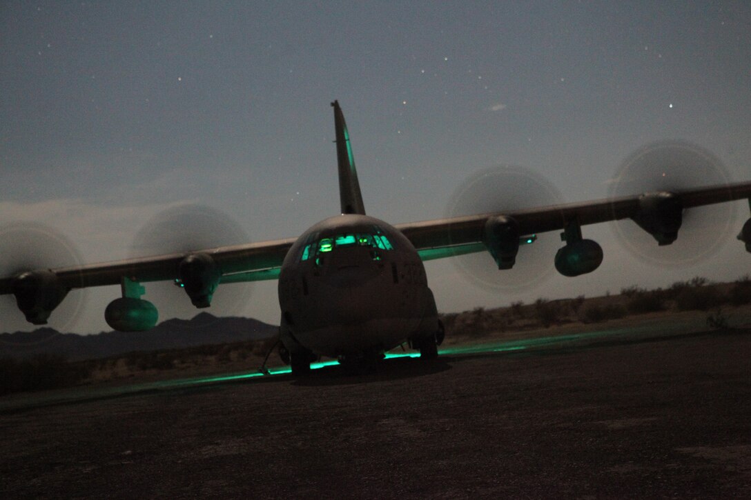 A Marine Corps KC-130 Hercules aircraft sits running on Stoval Airfield, near Dateland, Ariz., Oct. 15, 2010, in order to refuel Marine helicopters during a training mission as part of Weapons and Tactics Instructor course. The course, hosted twice a year at the Marine Corps Air Station in Yuma, Ariz., by Marine Aviation and Weapons Tactics Squadron 1, trains Marine students from across the globe to return to their units as training officers versed in the latest aviation tactics and procedures. The Stoval Airfield is located within the Barry M. Goldwater Range in southwest Arizona. The versatile KC-130s are often used for aerial refueling of jets and helicopters, but can refuel from the ground as well.