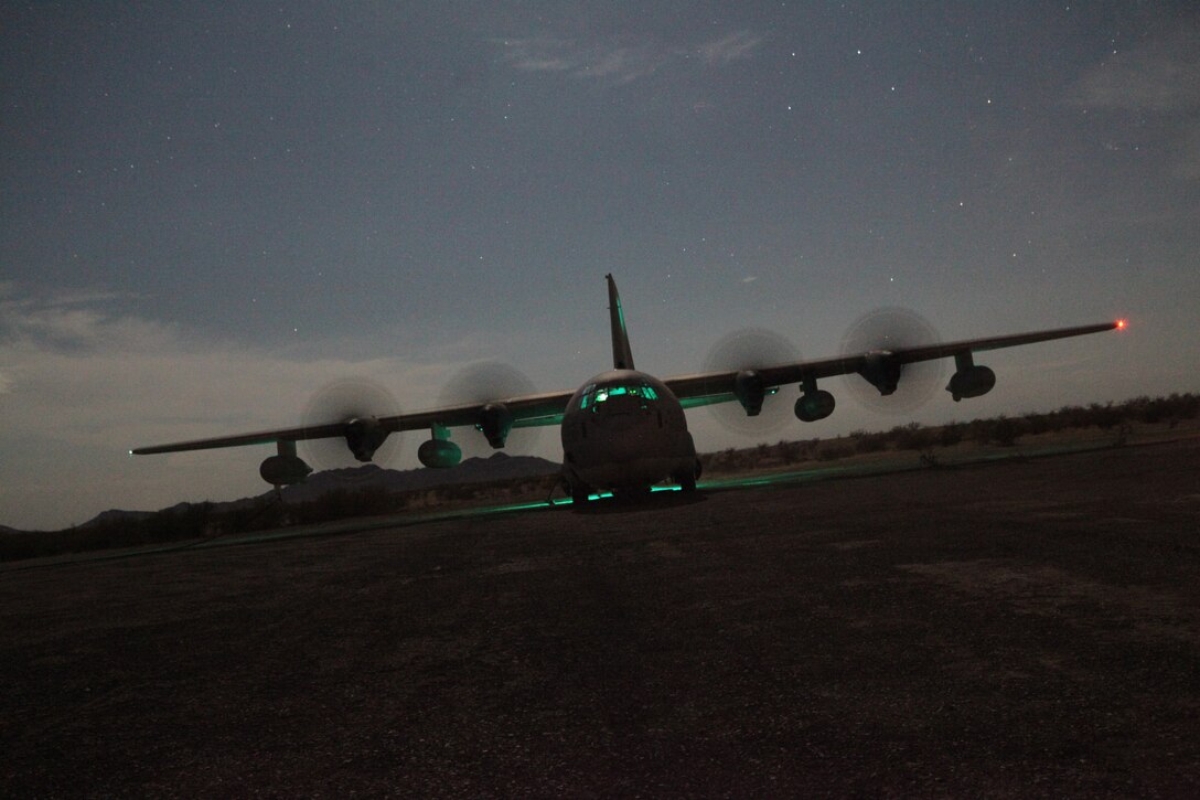 A Marine Corps KC-130 Hercules aircraft sits running on Stoval Airfield, near Dateland, Ariz., Oct 15, 2010, in order to refuel Marine helicopters during a training mission as part of Weapons and Tactics Instructor course. The course, hosted twice a year at the Marine Corps Air Station in Yuma, Ariz., by Marine Aviation and Weapons Tactics Squadron 1, trains Marine students from across the globe to return to their units as training officers versed in the latest aviation tactics and procedures. The Stoval Airfield is located within the Barry M. Goldwater Range in southwest Arizona. The versatile KC-130s are often used for aerial refueling of jets and helicopters, but can refuel from the ground as well.
