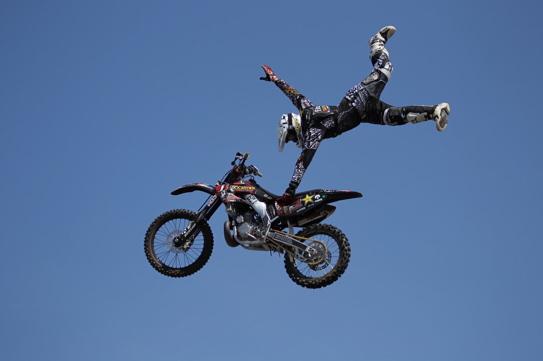 Derek Garland, a rider with the Metal Mulisha Troops, pulls off one of many aerial stunts Saturday aboard the Combat Center for those in attendance to the Commanding General’s Car and Bike show. The Troops did three shows Saturday.::r::::n::