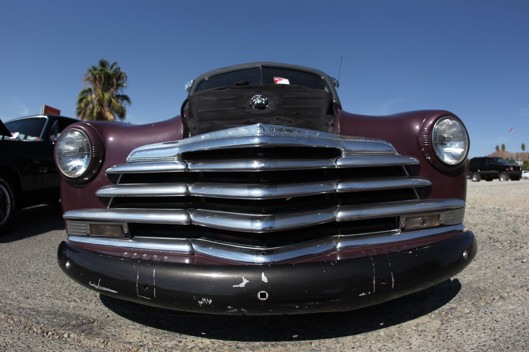 Lieutenant Col. Dick Penley’s 1934 Ford truck sits on display at the Commanding General’s Car and Bike show Saturday. Along with a display of vehicles, three Metal Mulisha Troops put on a show across the street with their stunt bikes.::r::::n::