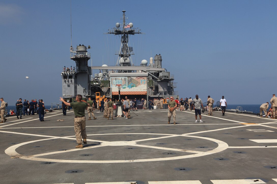 Fishing, baseball and other sports activities took place on the flight deck of USS Ponce during a steel beach picnic to increase moral and camaraderie for sailors and Marines, Oct. 16, 2010. 26th Marine Expeditionary Unit is currently embarked aboard the ships of Kearsarge Amphibious Ready Group operating in the 5th Fleet area of responsibility.