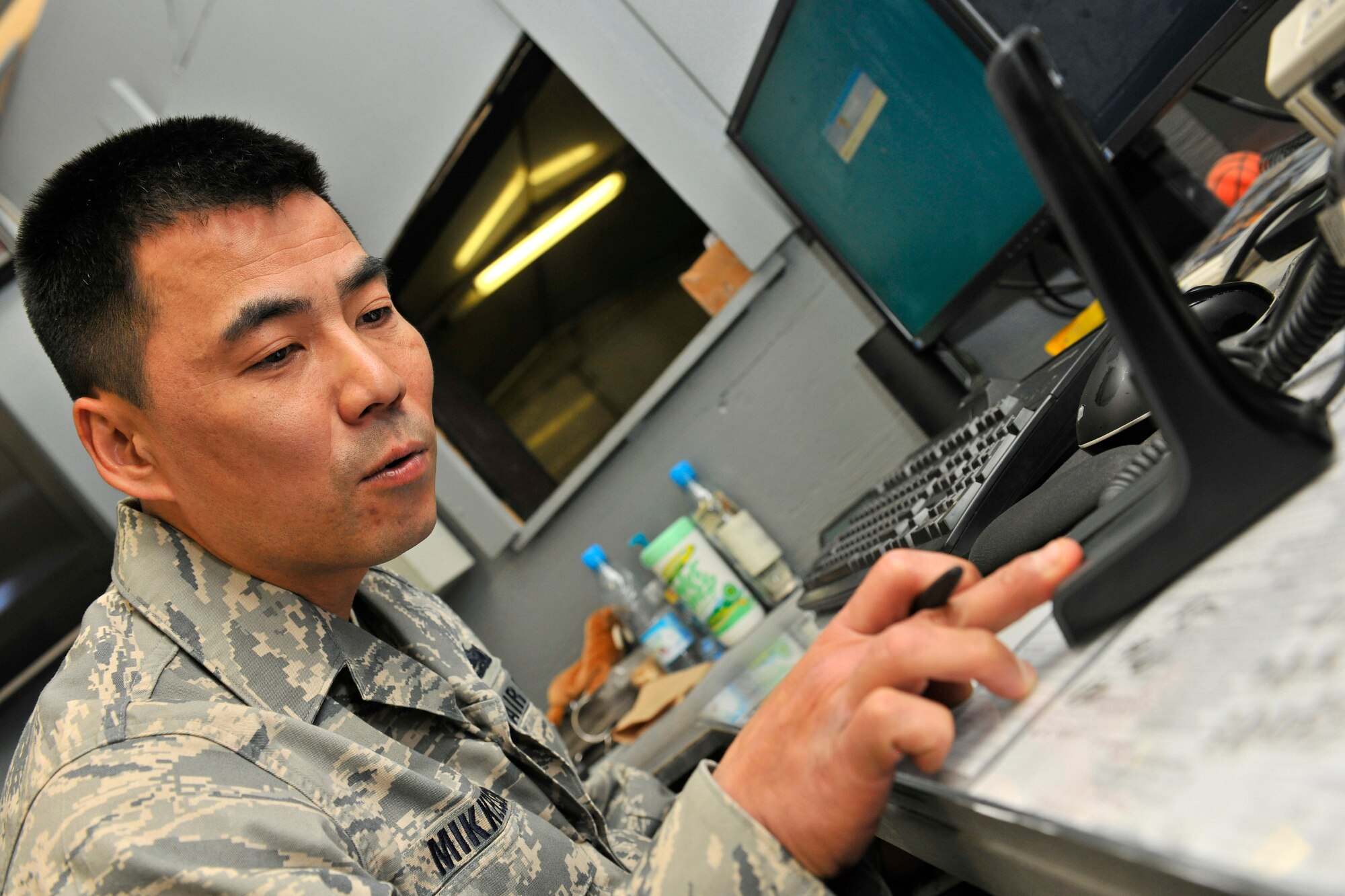 Tech. Sgt. Jeff Mikkelson, the 455th Expeditionary Logistics Readiness Squadron non-commissioned officer in charge of the fuels service center, sends a refueling assignment to operators on the flight line at Bagram Air Field, Afghanistan, Oct. 14, 2010. The fuels service center receives more than 300 fuel requests a day and are met in less than 30 minutes on average. The Petroleum Oils and Lubricants flight, ranked fourth in the Air Force for most gallons pumped, pumps 8 to 9 million gallons monthly worth about $16 million. Sergeant Mikkelson is a native of Montague, Mich. (U.S. Air Force photo/Staff Sgt. Christopher Boitz)