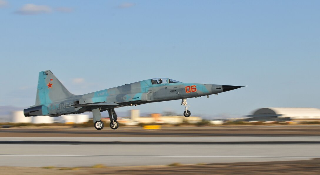Participating in the semiannual Weapons and Tactics Instructor course, an F-5 Tiger II jet assigned to Marine Fighter Attack Training Squadron 401 descends for a landing on the flight line of the Marine Corps Air Station in Yuma, Ariz., on Oct. 16, 2010. As the Marine Corps’ only squadron to fly the F-5 jets, the pilots of VMFT-401 portray enemy aircraft for pilots training in Yuma. WTI, hosted by Marine Aviation Weapons and Tactics Squadron 1, trains Marine students from across the globe to return to their units as training officers versed in the latest aviation tactics and procedures.