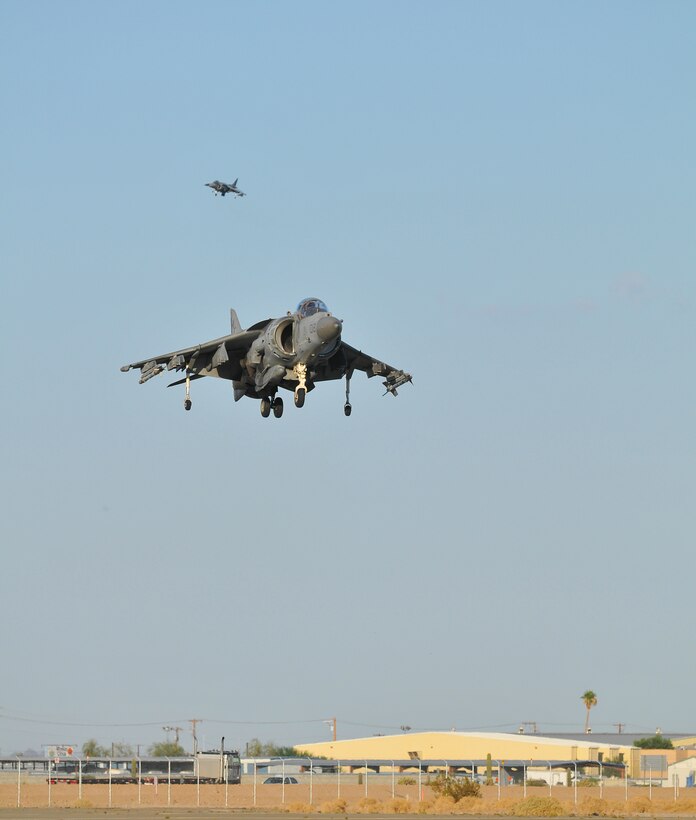 Participating in the semiannual Weapons and Tactics Instructor course, an AV-8B Harrier jet assigned to Marine Attack Squadron 513 descends for a landing on the flight line of the Marine Corps Air Station in Yuma, Ariz., on Oct. 16, 2010. WTI, hosted by Marine Aviation Weapons and Tactics Squadron 1, trains Marine students from across the globe to return to their units as training officers versed in the latest aviation tactics and procedures.