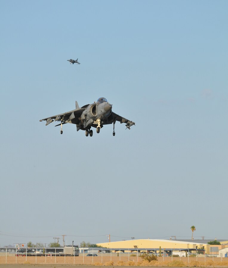 Participating in the semiannual Weapons and Tactics Instructor course, an AV-8B Harrier jet assigned to Marine Attack Squadron 513 descends for a landing on the flight line of the Marine Corps Air Station in Yuma, Ariz., on Oct. 16, 2010. WTI, hosted by Marine Aviation Weapons and Tactics Squadron 1, trains Marine students from across the globe to return to their units as training officers versed in the latest aviation tactics and procedures.