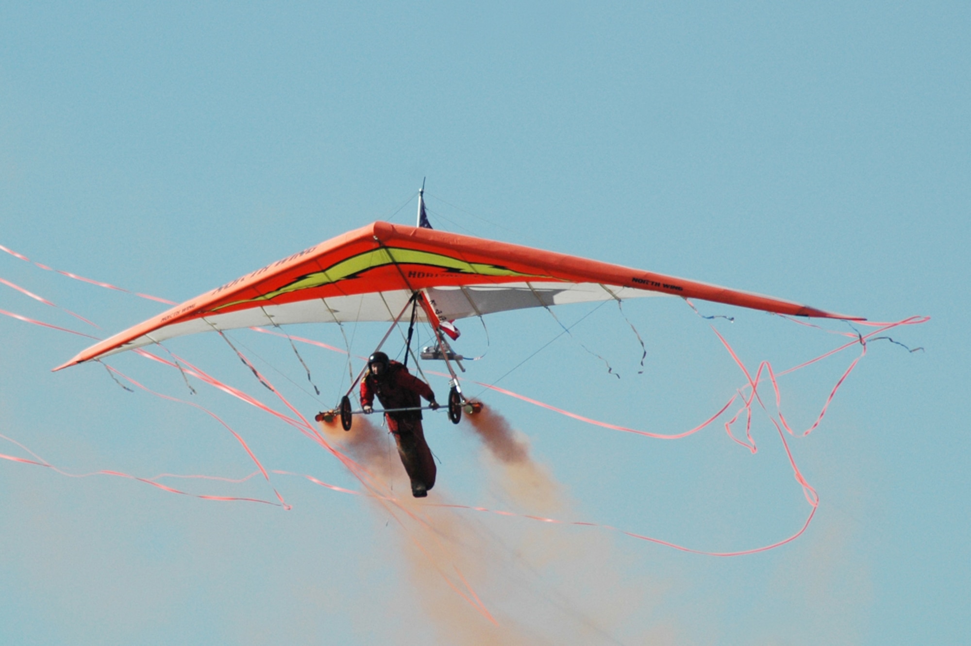 Providing a colorful visual experience during the opening ceremony, Dan Buchanan soars above the Wings Over Atlanta Air Show with his glider. (U.S. Air Force photos/Master Sgt. Dennis Travon)