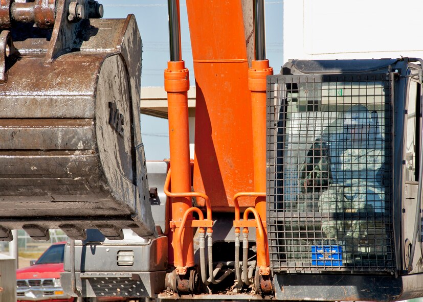 Col. Sal Nodjomian, 96th Air Base Wing commander, drives the excavator toward the old Eglin Air Force Base NCO club prior to kicking off its demolition Oct. 15.  The club will be completely removed by mid-November to make way for Navy EOD dormitories.  The dorms are scheduled to be complete by Summer 2011.  (U.S. Air Force photo/Samuel King Jr.)