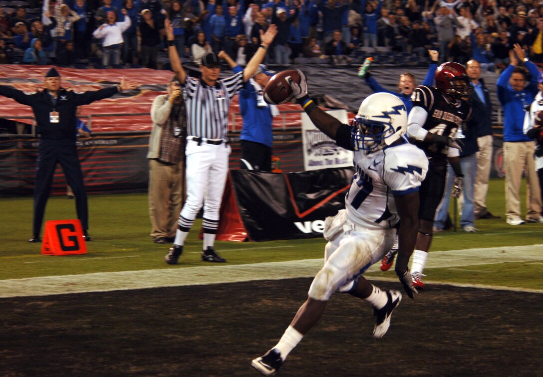Air Force Running back Asher Clark goes in for the touchdown following a 20-yard run Saturday, Oct. 16, 2010 at San Diego's Qualcomm Stadium.  Clark recorded his second straight 100-yard game with 116 yards on 19 carries.  The Falcons lost the game 27-25 to the Aztecs of San Diego State.  (U.S. Air Force photo/Staff Sgt. Raymond Hoy)