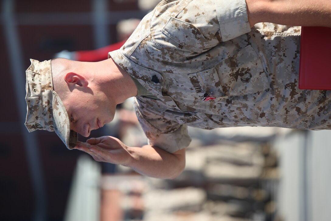 Sgt. Daniel Hubbert, a combat instructor for Company D, Infantry Training Battalion, School of Infantry-East, salutes after receiving the Bronze Star medal with a combat distinguishing device during an award ceremony aboard Camp Geiger, Oct. 18. Hubbert earned the award for his actions while deployed to Now Zad, Afghanistan, with 3rd Battalion, 8th Marine Regiment, 2nd Marine Division, in support of Operation Enduring Freedom.