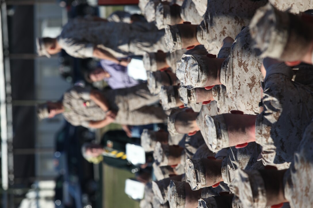 Marines from Infantry Training Battalion, School of Infantry-East, listen to Lt. Col. Jeffrey Rule, commanding officer of ITB, SOI-East, after an award ceremony aboard Camp Geiger, Oct. 18. The ceremony honored Sgt. Daniel Hubbert, a combat instructor for Company D, ITB, SOI-East, who received the Bronze Star medal with a combat distinguishing device for his actions and bravery while deployed to Now Zad, Afghanistan, in support of Operation Enduring Freedom.::r::::n::