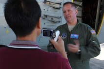 JOINT BASE PEARL HARBOR-HICKAM, Hawaii - Burt Lum, host of Hawaii Public Radio "Byte Marks Cafe," interviews Col. Gary James, 109th Operations Group commander, about the LC-130 Hercules here, Oct. 18. The LC-130 is on its way to Antarctica for Operation Deep Freeze. Its unique skis allow the air craft to perform operations in snow conditions. (U.S. Air Force photo/Senior Airman Gustavo Gonzalez)