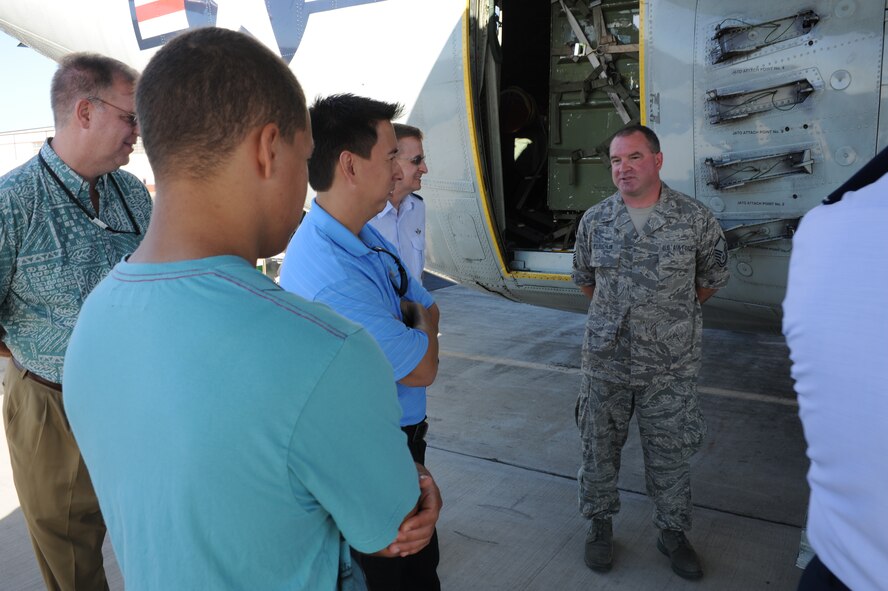 JOINT BASE PEARL HARBOR-HICKAM, Hawaii - Master Sgt. Daniel Mcloughlin, 109th  Air Craft Maintenance Squadron crew chief, briefs media about the LC-130 Hercules here, Oct. 18. The LC-130 is on its way to Antarctica for Operation Deep Freeze. Its unique skis allow the air craft to perform operations in snow conditions. (U.S. Air Force photo/Senior Airman Gustavo Gonzalez)