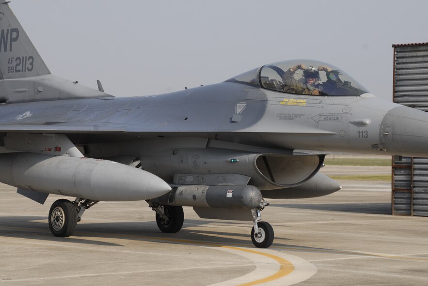 An F-16 Fighting Falcon aircraft and pilot from Kunsan Air Base, Republic of Korea return to Kwangju Air Base, ROK, following a training mission Oct. 18 during exercise Max Thunder 10-02. (U.S. Air Force photo/Staff Sgt. Eric Burks)