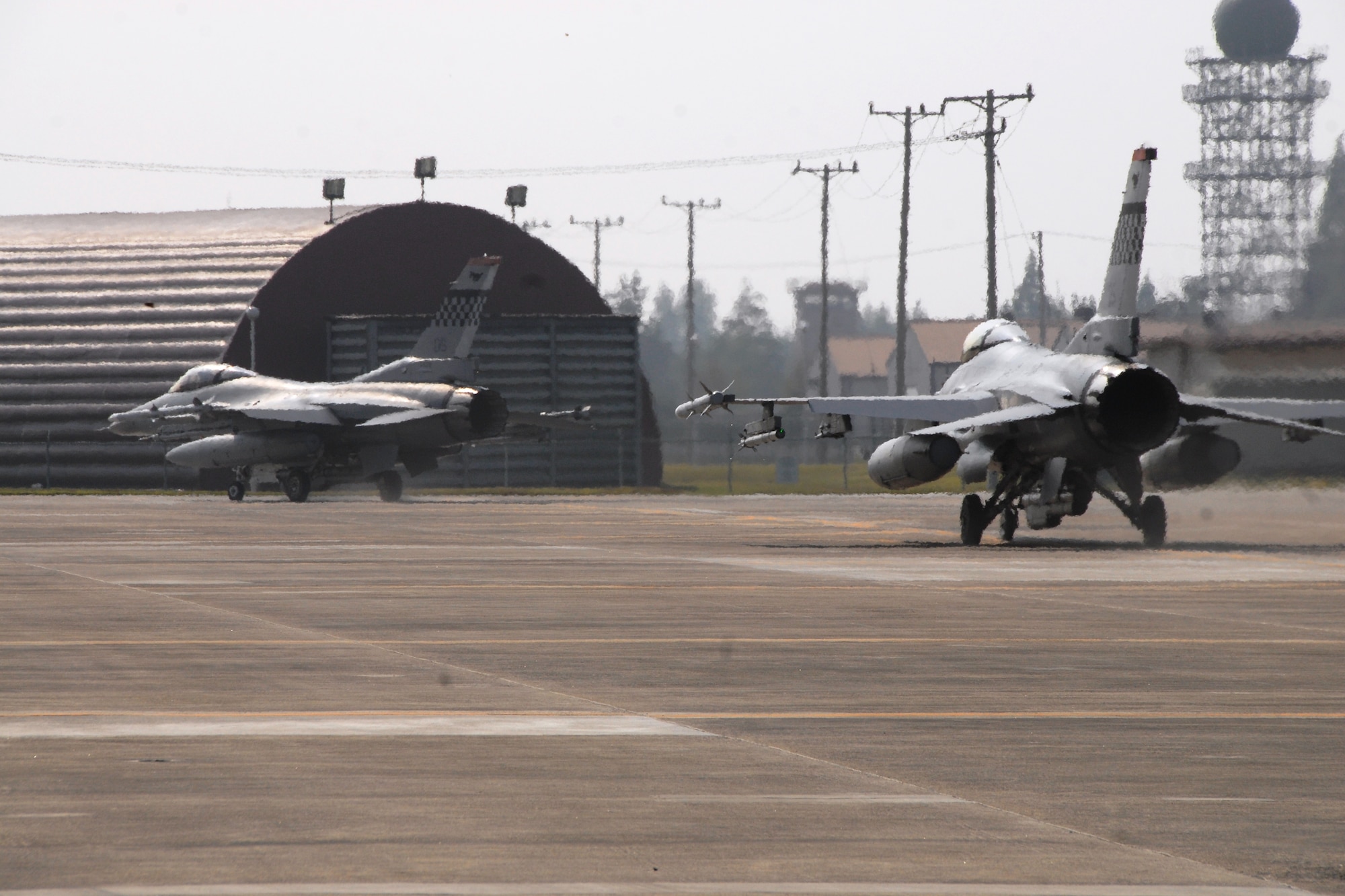 F-16 Fighting Falcon aircraft from the 36th Fighter Squadron, Osan Air Base, Republic of Korea, taxi to the runway Oct. 18 during exercise Max Thunder 10-02 at Kwangju Air Base, Republic of Korea. (U.S. Air Force photo/Staff Sgt. Eric Burks)