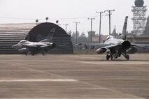 F-16 Fighting Falcon aircraft from the 36th Fighter Squadron, Osan Air Base, Republic of Korea, taxi to the runway Oct. 18 during exercise Max Thunder 10-02 at Kwangju Air Base, Republic of Korea. (U.S. Air Force photo/Staff Sgt. Eric Burks)