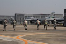8th Maintenance Group Airmen from Kunsan Air Base, Republic of Korea, conduct a Foreign Object Debris walk Oct. 18 at Kwangju Air Base, ROK, during exercise Max Thunder 10-02. (U.S. Air Force photo/Staff Sgt. Eric Burks)