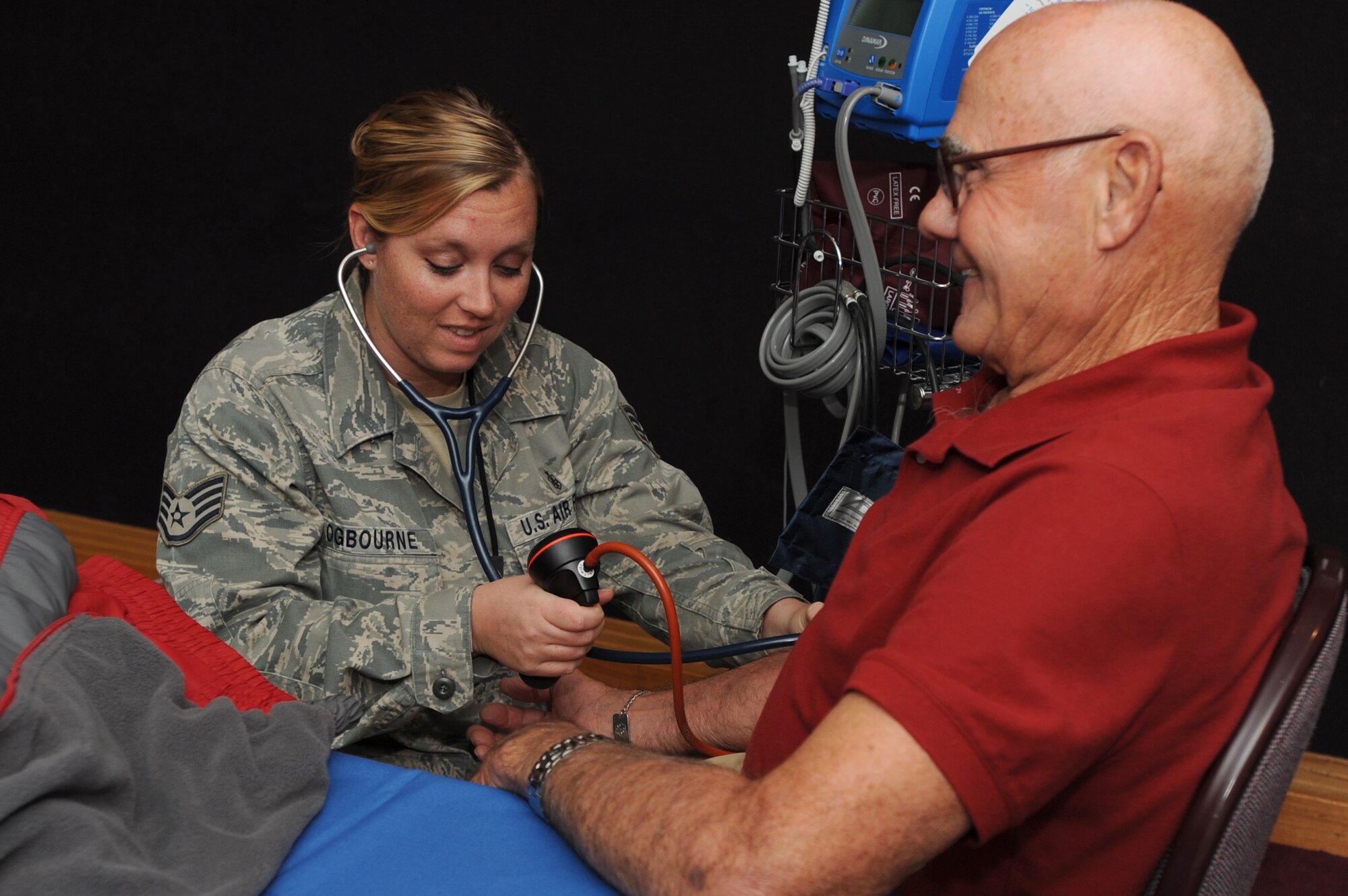 WHITEMAN AIR FORCE BASE, Mo. - Staff Sgt. Jennifer Ogbourne, 509th Medical Operations Squadron aerospace medical technician checks a retirees blood pressure during the Retiree Appreciation Day, Saturday. The Retiree Appreciation Day hosted more than 350 retirees for briefings ranging from retiree entitlements and base information and tours. (U.S. Air Force photo by Senior Airman Carlin Leslie)
