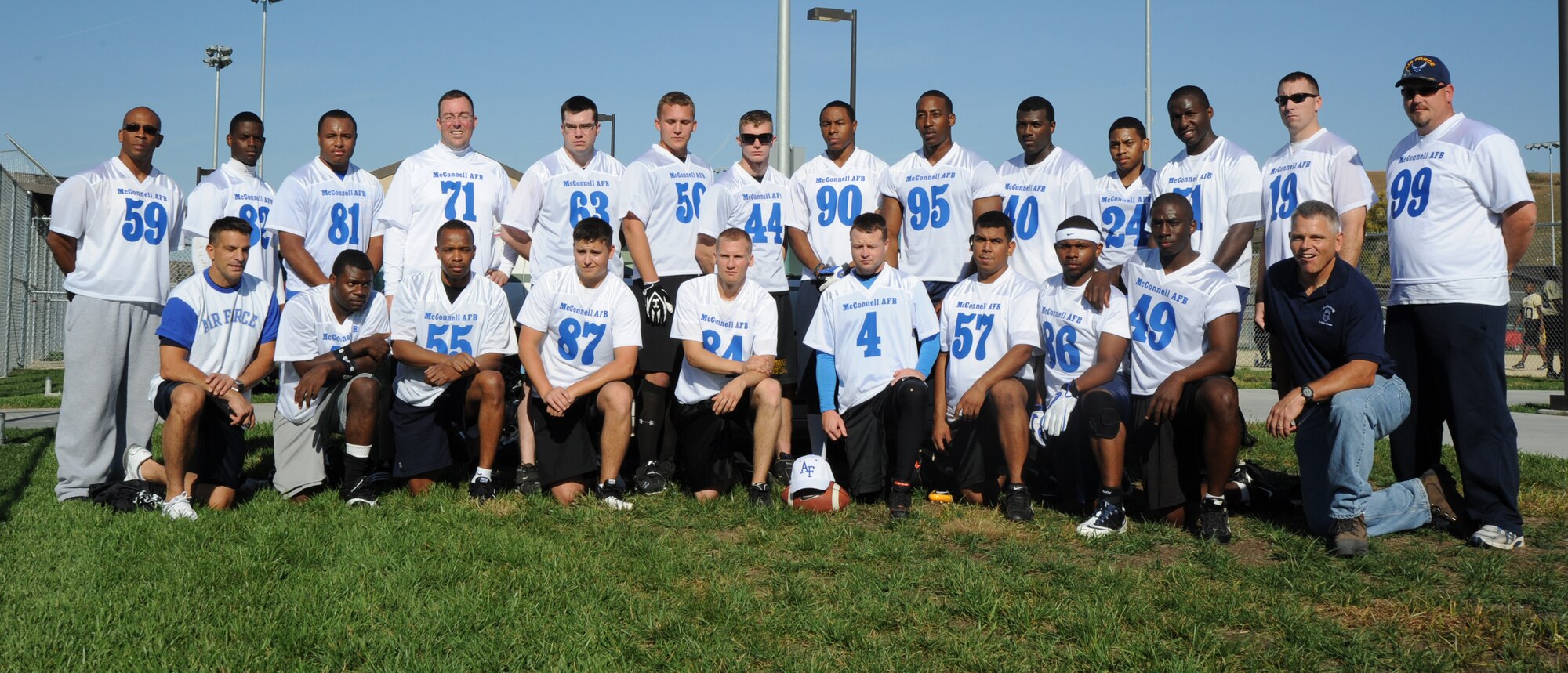 Prior to their game, McConnell Air Force Base’s flag football team poses for a picture Oct. 16, 2010, at the Fort Riley, Kan., sports complex. The team competed against Fort Riley’s flag football team as a rematch to the McConnell vs. Fort Riley game held in 2009. The Fort Riley Soldiers won the rematch 13-6. (U.S. Air Force photo/Airman 1st Class Armando A. Schwier-Morales)