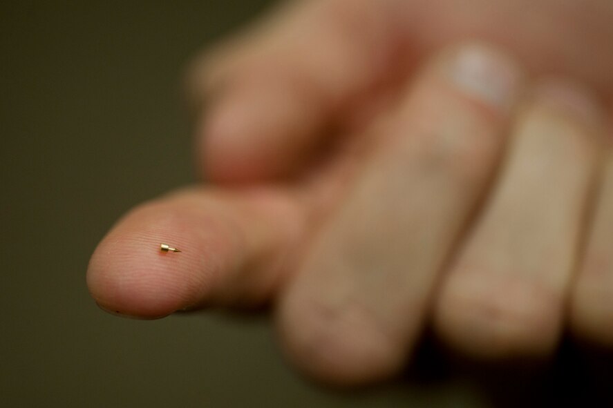 MOODY AIR FORCE BASE, Ga. -- Capt. Trevor Ambron, 822nd Base Defense Squadron physician’s assistant, shows an example of an acupuncture needle injector at Moody Air Force Base, Ga., Oct. 14. The sterilized needles are small enough to carry in a pocket and can be applied easily to someone wearing full combat gear. (U.S. Air Force photo/Senior Airman Jamal D. Sutter) 
